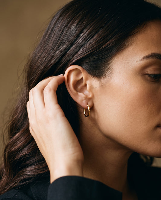 Gold Filled 12mm Hoop Earrings worn by a model
