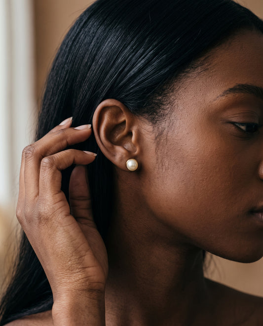 Gold Filled 7mm Pearl Stud Earrings worn by a model