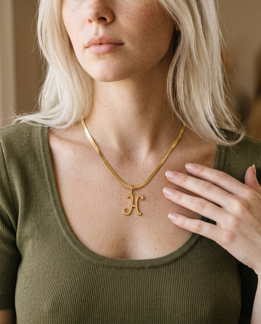 Gold Filled Script Initial Herringbone Necklace worn by a model