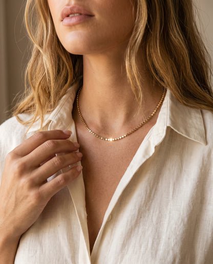 Gold Filled 1.5mm Flat Ball Necklace worn by a model