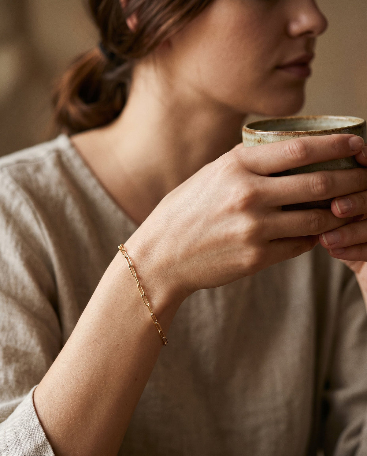 Gold Filled 1.5mm Paperclip Bracelet worn by a model