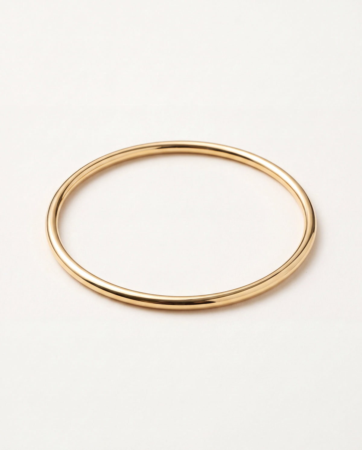 18KT Gold Filled Bangles, Gold Filled 2mm Bangle Bracelet | 18K Gold-Filled Stackable Bangle – 2.25" & 2.5" by HAUS OF MON...