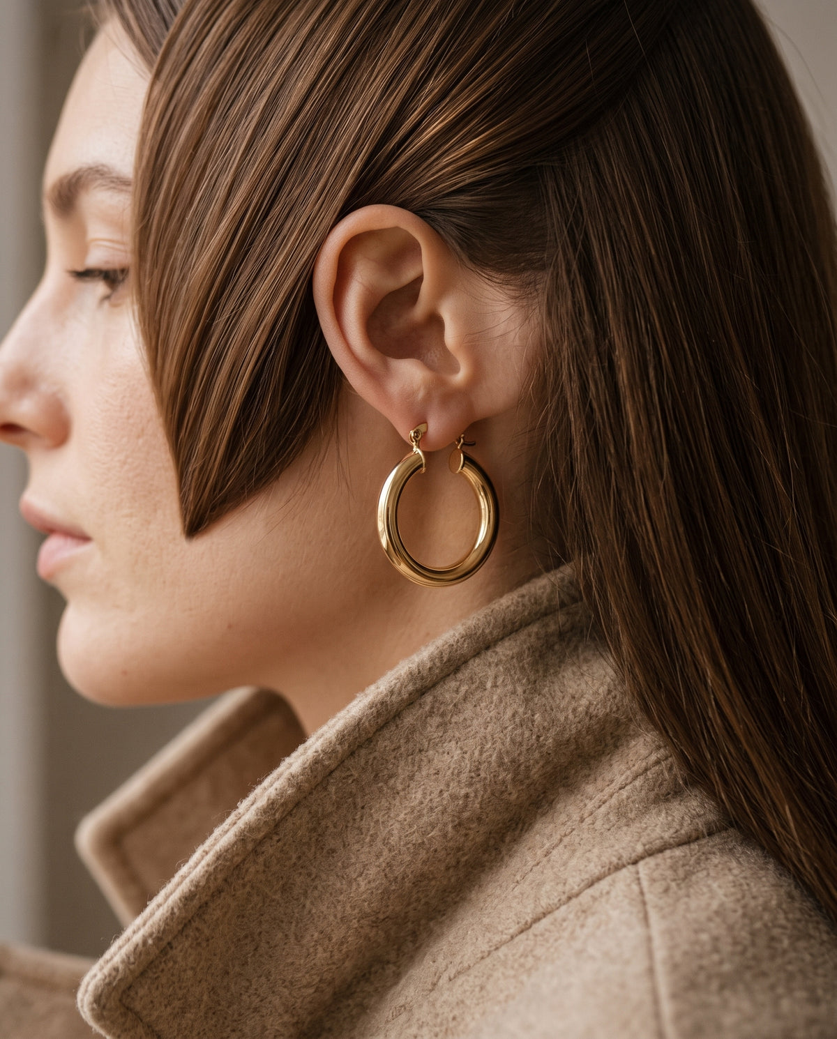 Gold Filled 30mm Hoop Earrings worn by a model