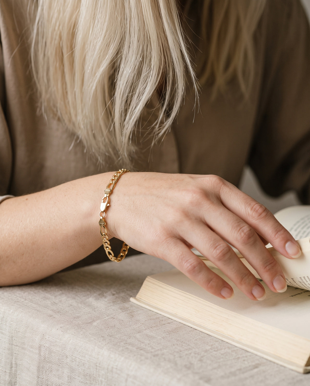 Gold Filled 4mm Figaro Bracelet worn by a model