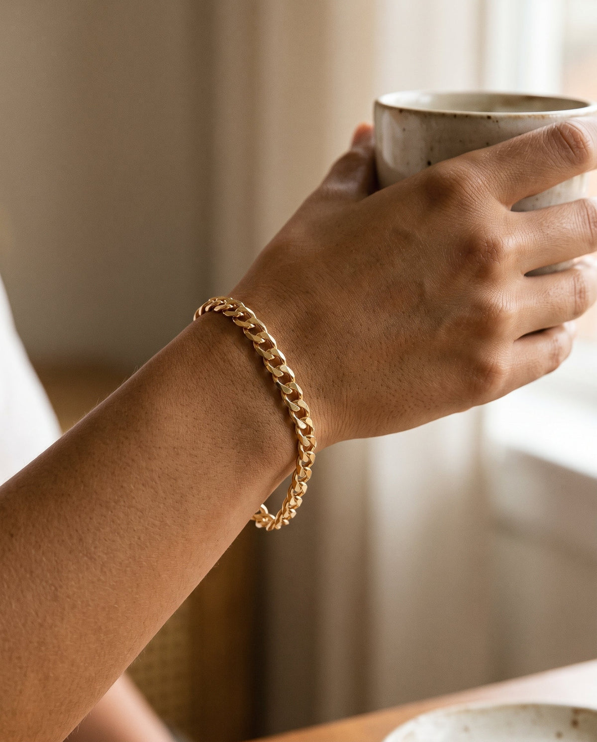 Gold Filled 5.5mm Curb Bracelet worn by a model
