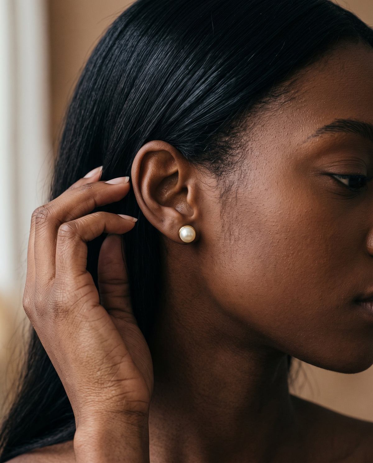 Gold Filled 7mm Pearl Stud Earrings worn by a model