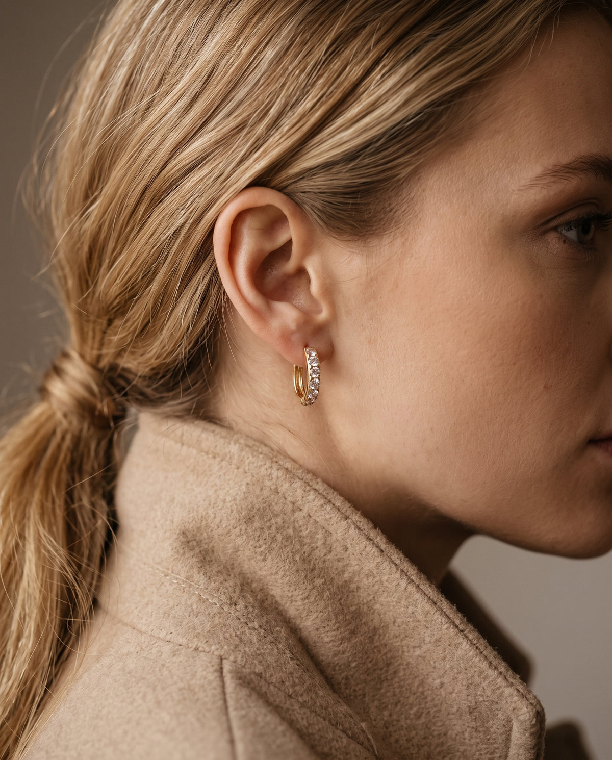 Gold Filled 8mm CZ Mini Hoops worn by a model
