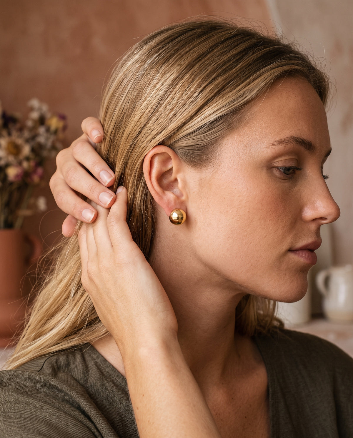 Gold Filled 9mm Stud Earrings worn by a model