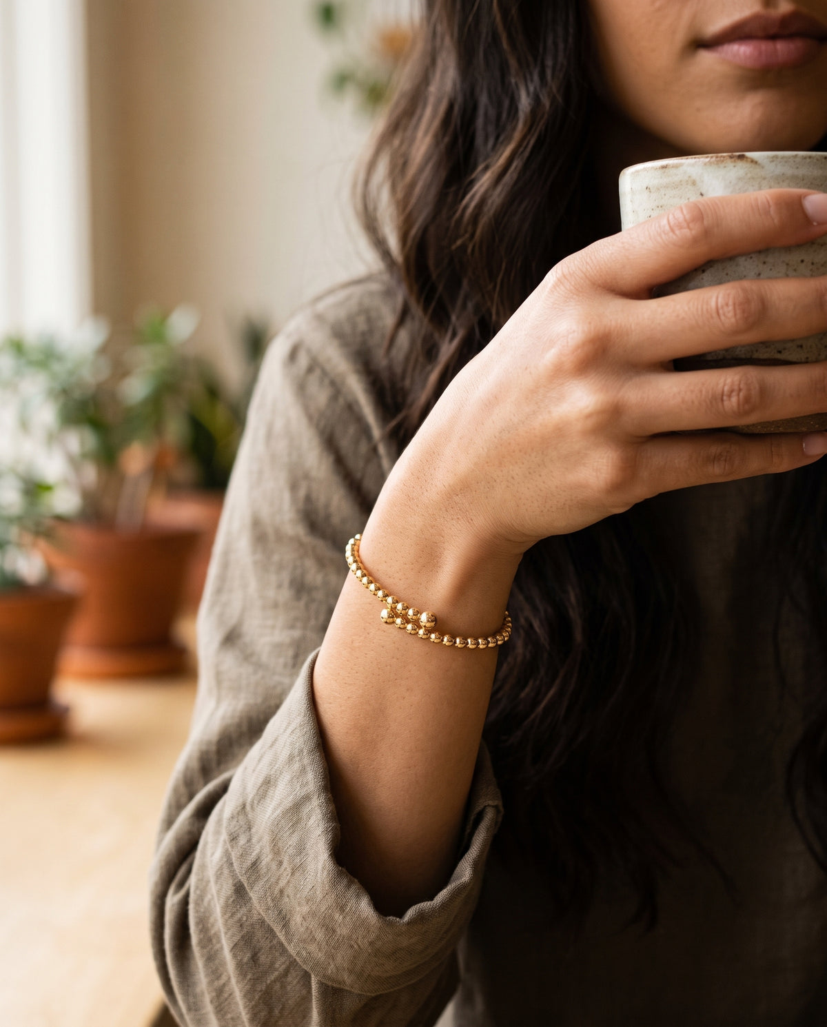 Gold Filled Beaded Bangle worn by a model