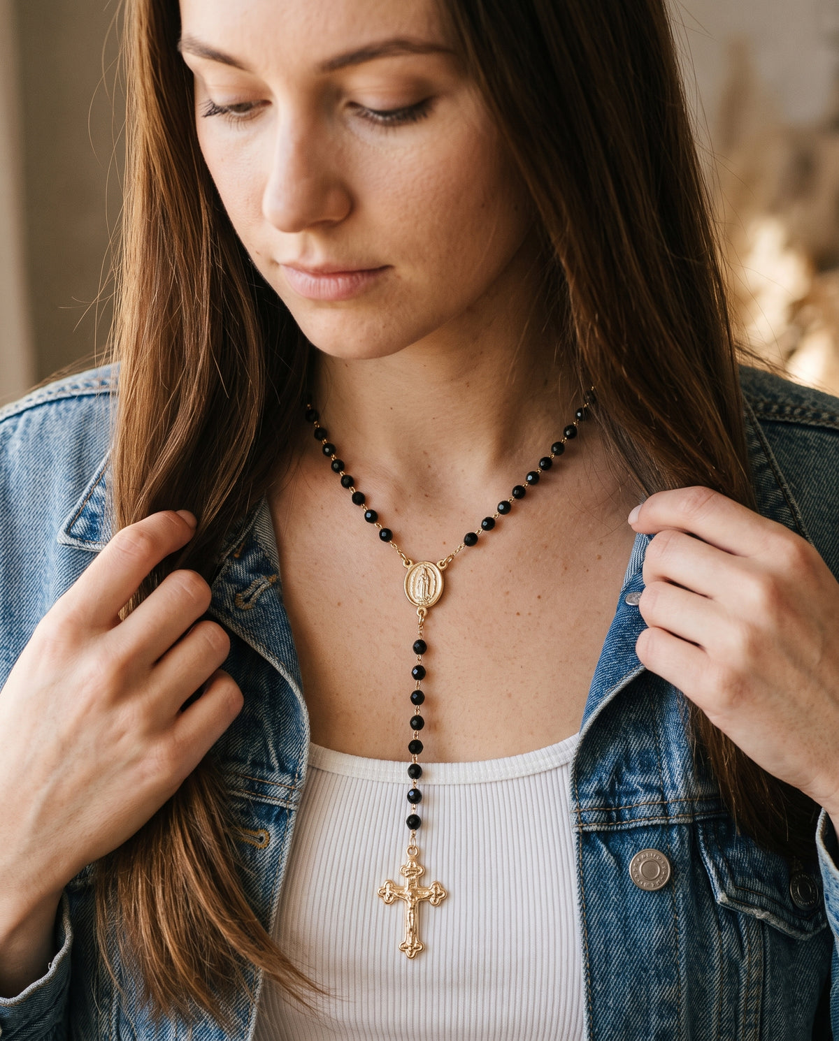 Gold Filled Black Crystal Rosary Necklace worn by a model