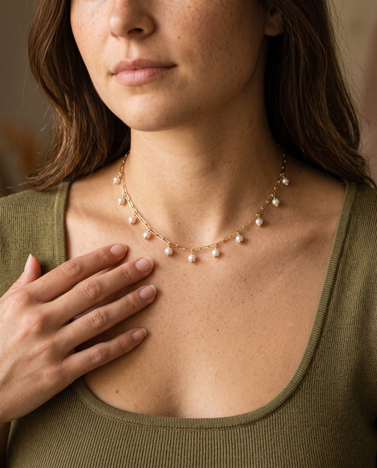 Gold Filled Dangling Pearl Necklace worn by a model