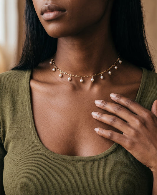 Gold Filled Dangling Pearl Necklace worn by a model