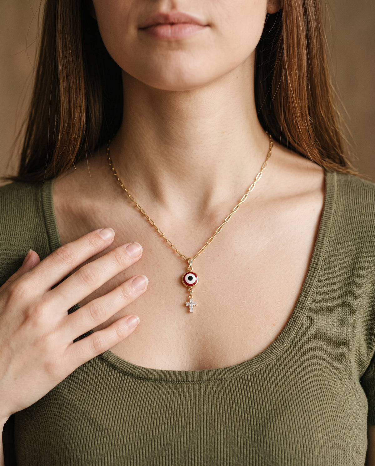 Gold Filled Evil Eye Cross Charm Necklace worn by a model