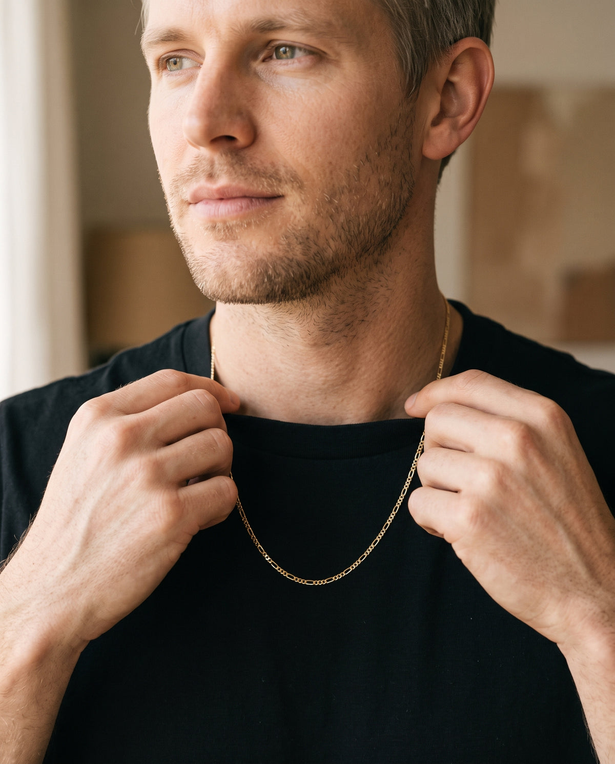 Gold Filled Figaro Chain worn by a model