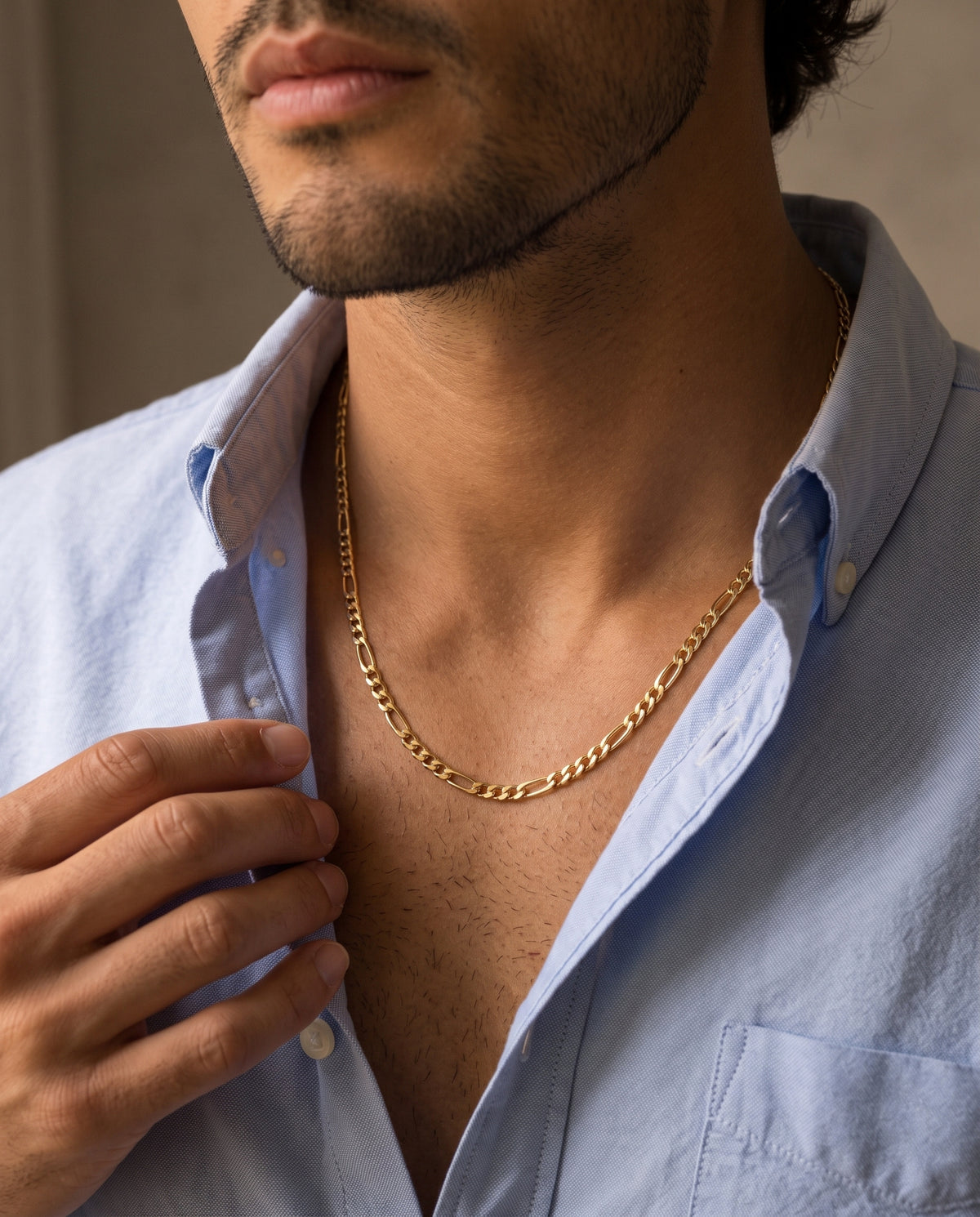 Gold Filled Figaro Chain worn by a model