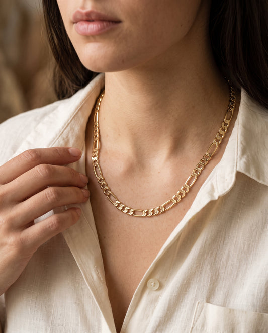 Gold Filled Figaro Chain worn by a model