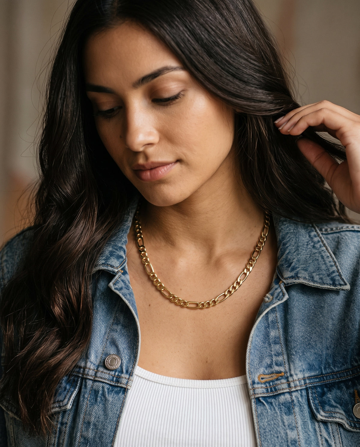 Gold Filled Figaro Chain worn by a model