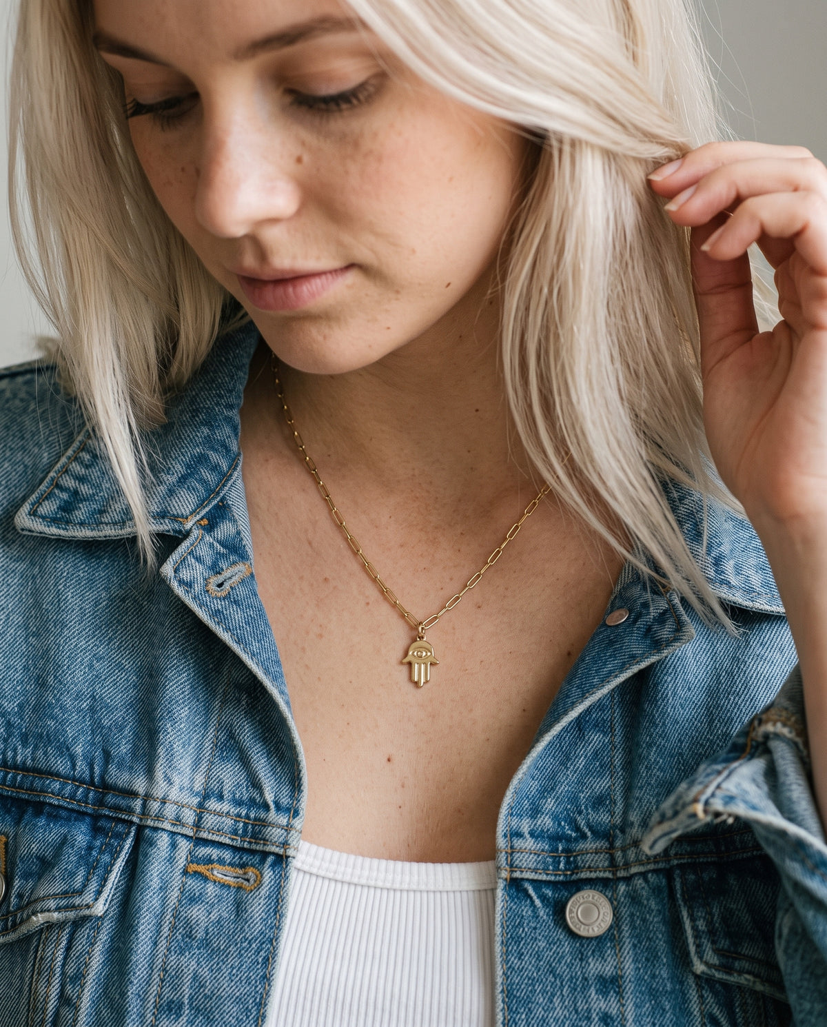 Gold Filled Hamsa Necklace worn by a model