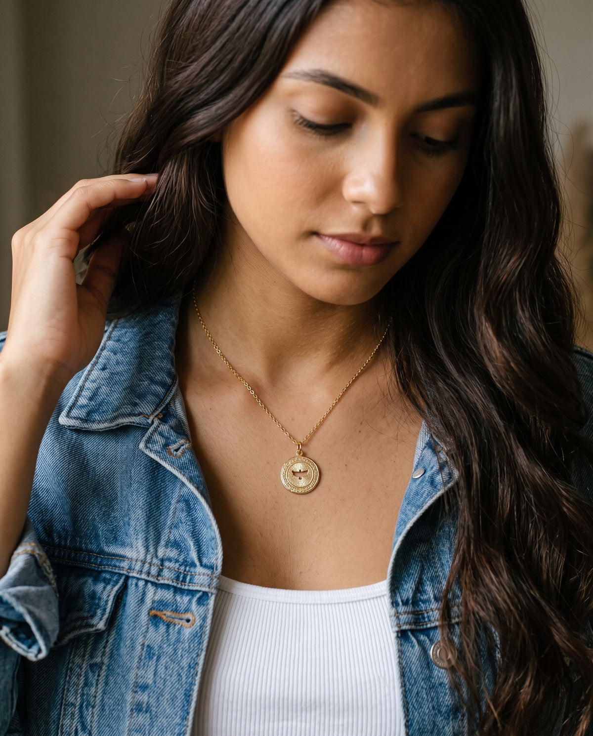 Gold Filled Holy Spirit Necklace worn by a model