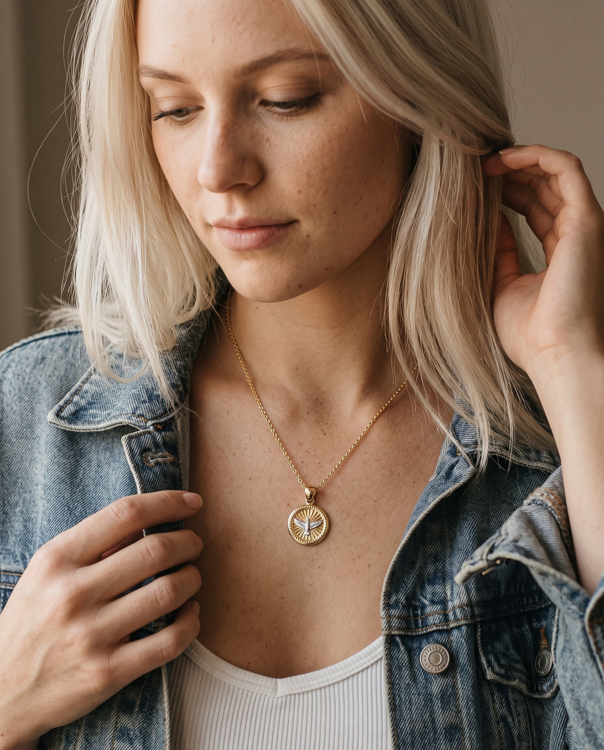 Gold Filled Holy Spirit Necklace worn by a model