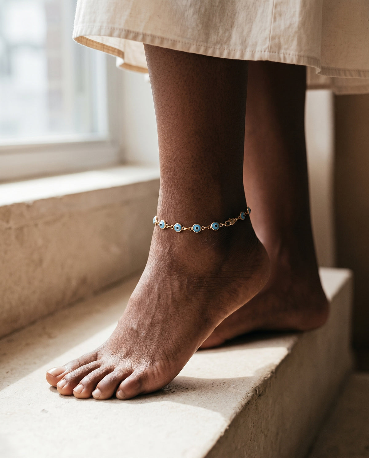 Gold Filled Light Blue Evil Eye Anklet worn by a model