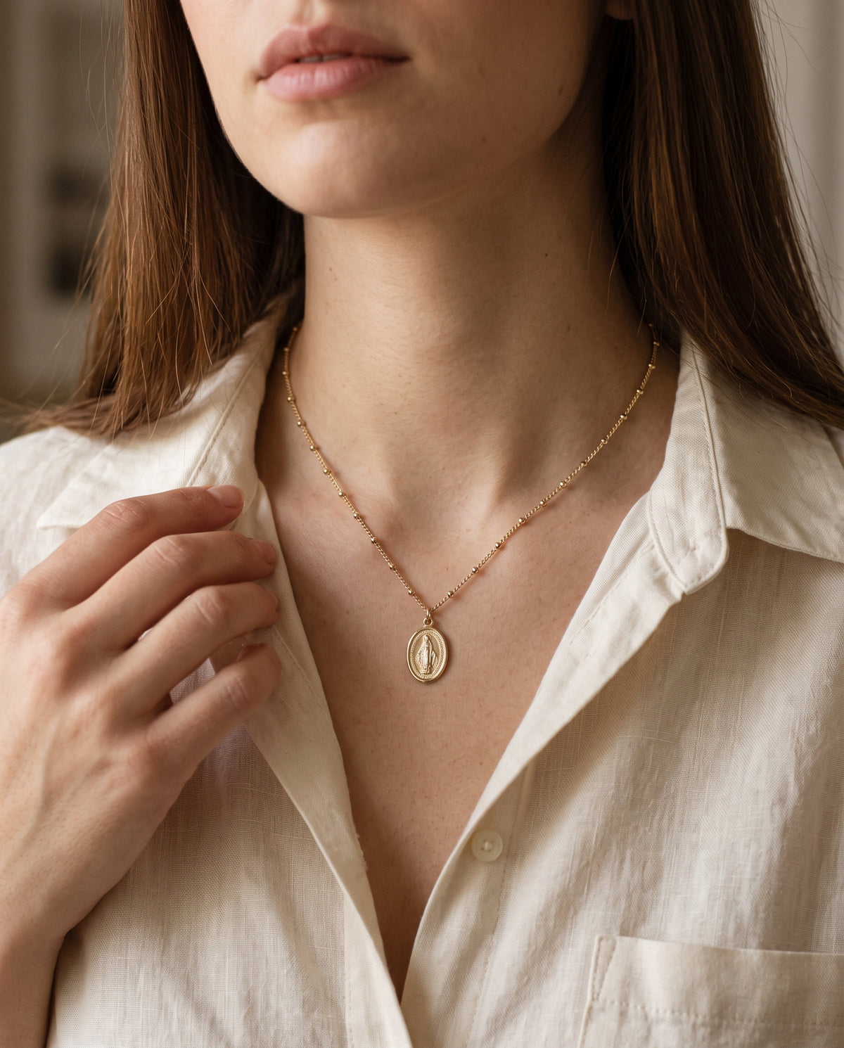Gold Filled Mini Miraculous Medal Necklace worn by a model