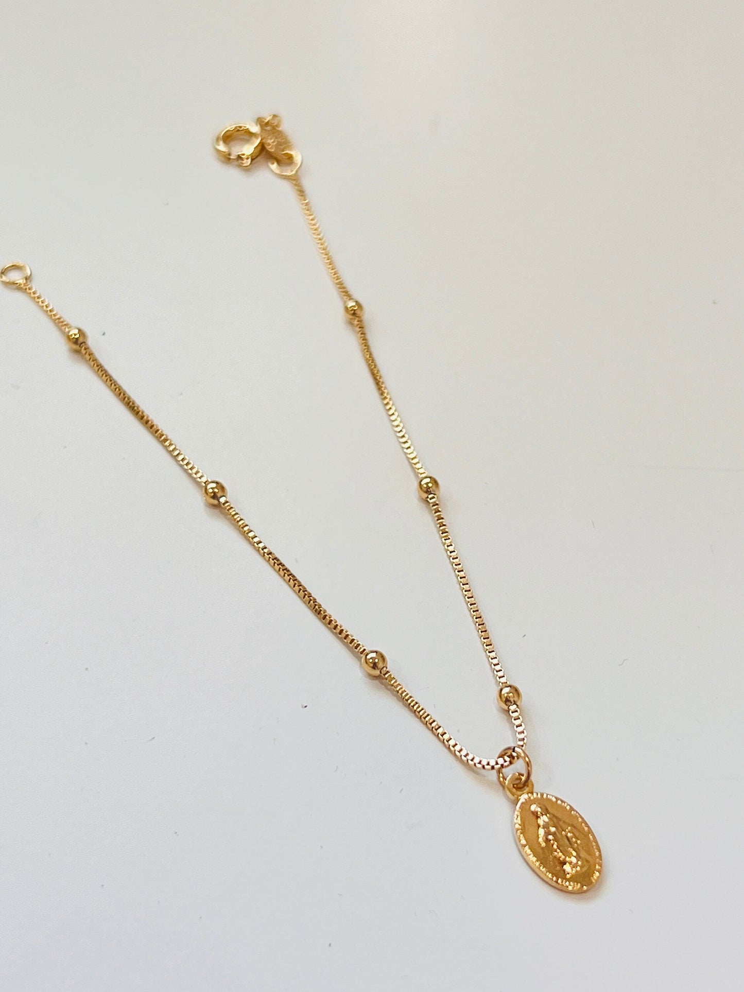 18KT Gold Filled Bracelets, Gold Filled Miraculous Medal Bracelet | Dainty Faith Charm Piece by HAUS OF MONOGRAM