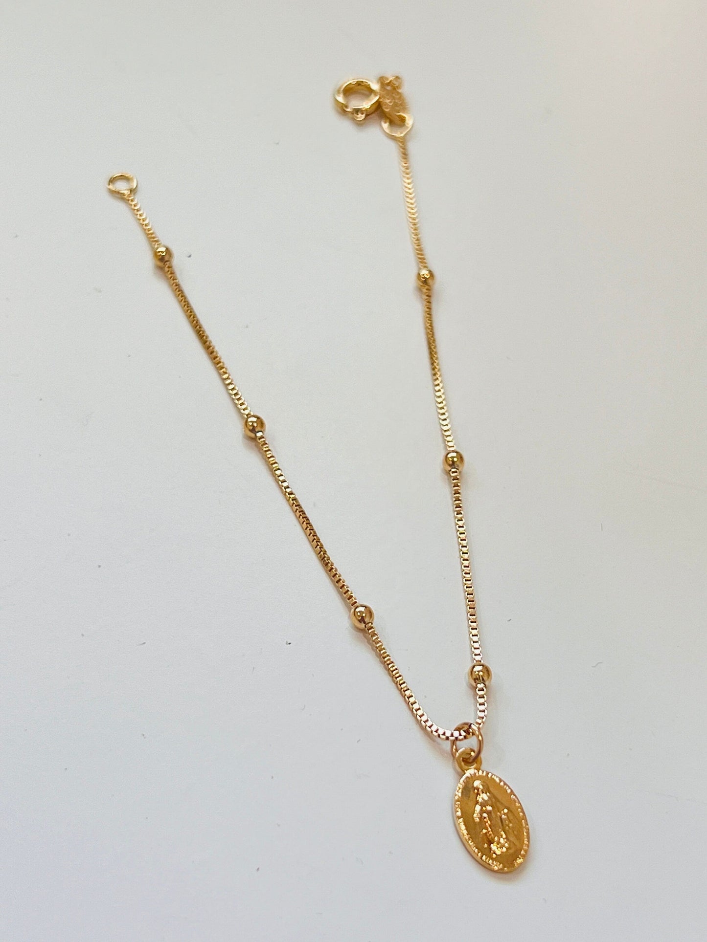 18KT Gold Filled Bracelets, Gold Filled Miraculous Medal Bracelet | Dainty Faith Charm Piece by HAUS OF MONOGRAM