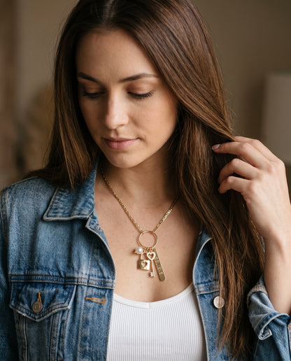 Gold Filled Multi Charm Necklace worn by a model