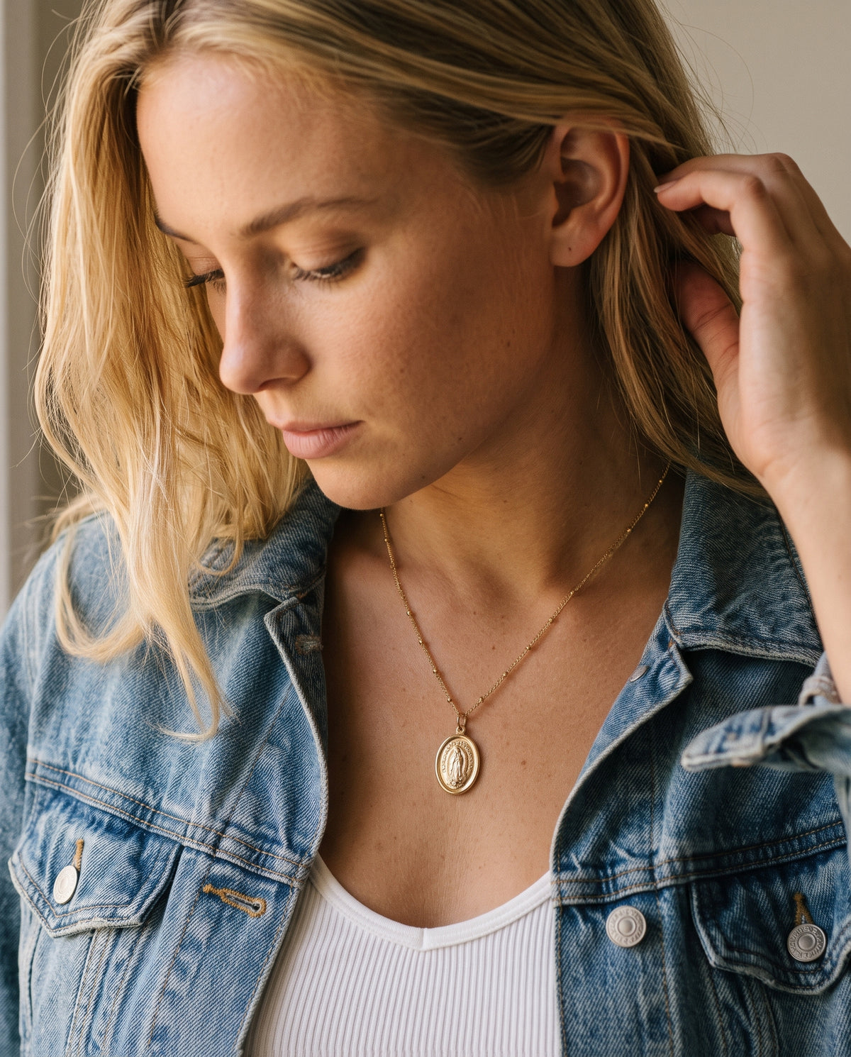 Gold Filled Our Lady of Guadalupe Necklace worn by a model