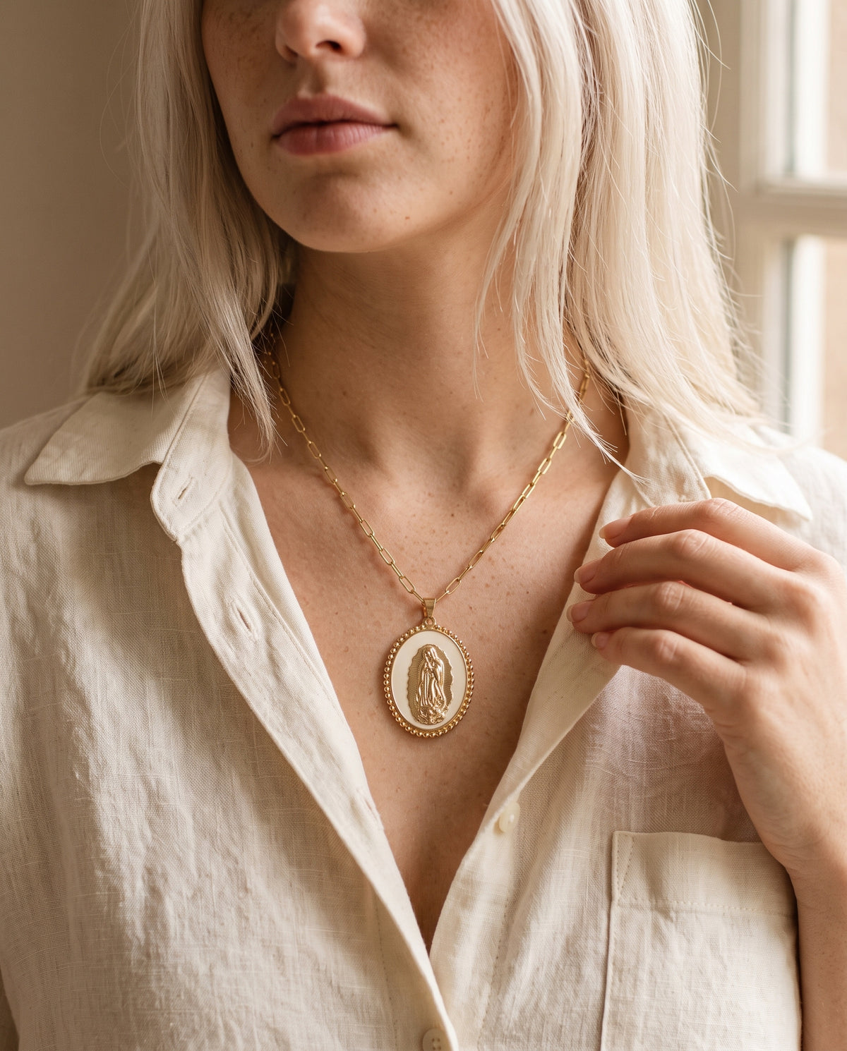 Gold Filled Our Lady of Guadalupe Necklace worn by a model