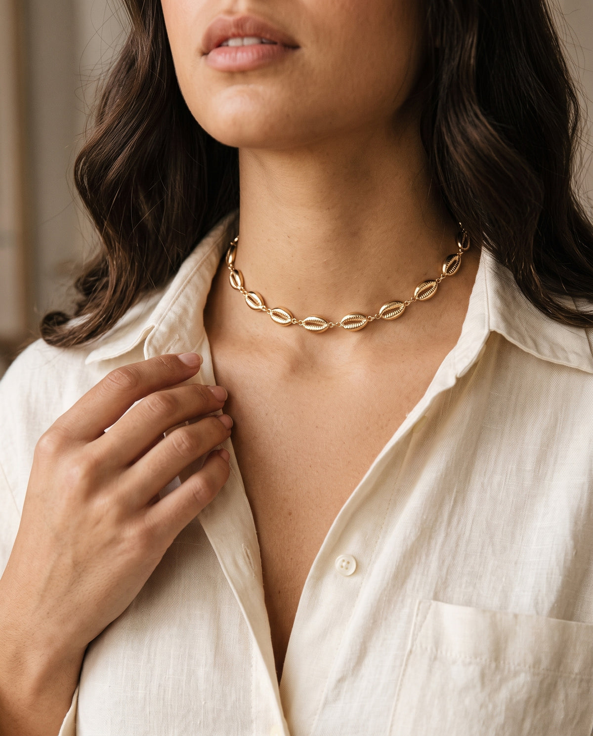 Gold Filled Puka Shell Choker worn by a model