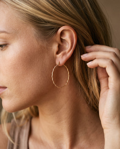 Gold Filled Ridged Hoop Earrings worn by a model