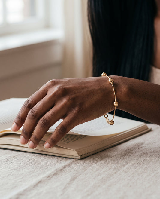 Gold Filled Snake Ball Bracelet worn by a model