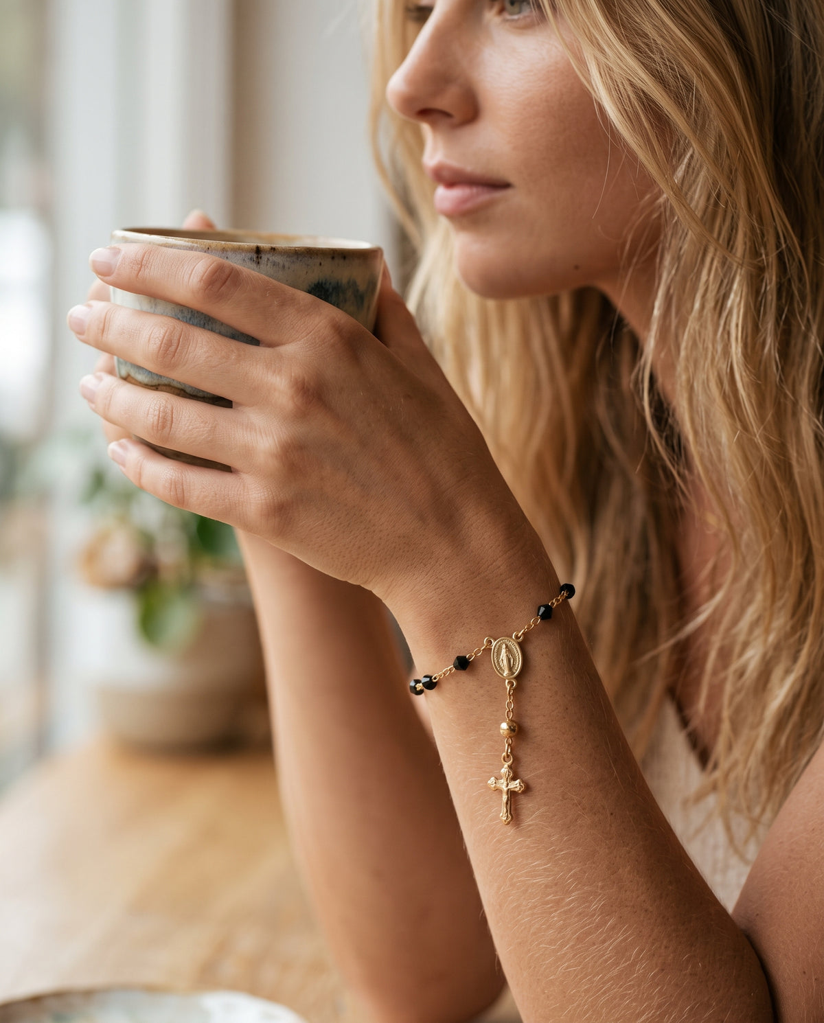 Gold Filled Virgin Mary Black Crystal Rosary Bracelet worn by a model