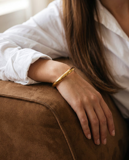 Gold Plated Stainless Steel Bangle worn by a model