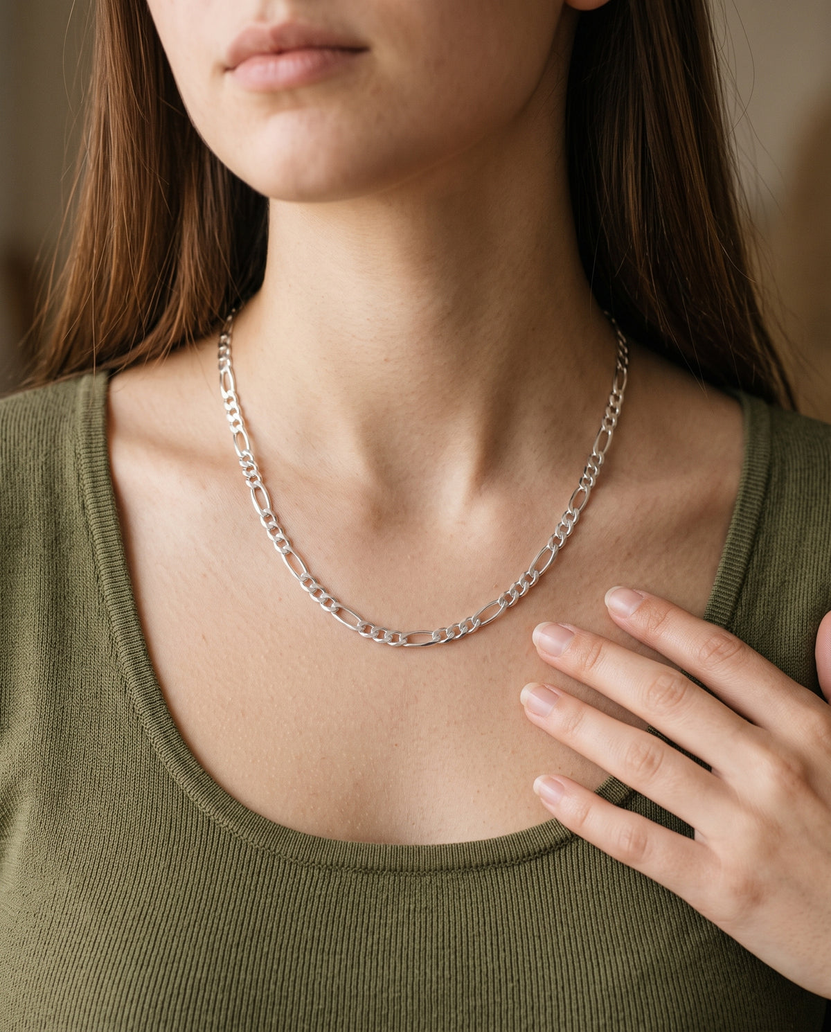 Sterling Silver Figaro Chain worn by a model
