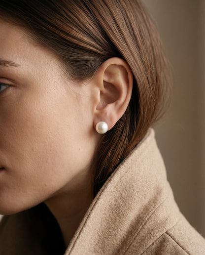 Sterling Silver Pearl Studs worn by a model